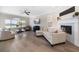 Spacious living room featuring a fireplace, TV, large windows and comfortable seating at 8685 E Bay Dr, Treasure Island, FL 33706