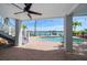 Covered patio with a view of the pool and dock at 8685 E Bay Dr, Treasure Island, FL 33706