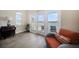 Bright sitting area with french doors leading to a balcony and views of the water at 8685 E Bay Dr, Treasure Island, FL 33706