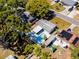 Bird's-eye view of a home with a private pool, screened lanai, and a solar-paneled roof at 8829 93Rd St, Seminole, FL 33777