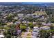 Aerial view of neighborhood featuring mature trees, sidewalks, and close proximity to a school at 8829 93Rd St, Seminole, FL 33777