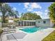 Inviting backyard pool area with a screened-in patio and outdoor seating, perfect for entertaining at 8829 93Rd St, Seminole, FL 33777