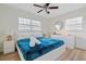 Bright bedroom with a plush blue comforter, white furniture, and plenty of natural light at 8829 93Rd St, Seminole, FL 33777