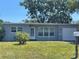 Charming single-story home featuring a well-maintained lawn, a quaint front entryway, and attached garage at 8829 93Rd St, Seminole, FL 33777