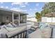 Inviting patio area with comfortable seating and a sparkling pool view, perfect for outdoor relaxation at 8829 93Rd St, Seminole, FL 33777