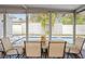 Inviting view of the pool from screened in porch with dining and seating area at 8829 93Rd St, Seminole, FL 33777