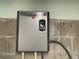 Modern Rheem Performance water heater against a cinder block wall, providing efficient hot water at 8829 93Rd St, Seminole, FL 33777