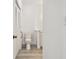 Bathroom featuring toilet, vanity and wood-look flooring at 9118 Lake Chase Island Way # 9118, Tampa, FL 33626