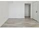 Empty bedroom featuring wood-look tile flooring and white trim at 9118 Lake Chase Island Way # 9118, Tampa, FL 33626