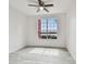 Bedroom with ceiling fan and large window showcasing a water view at 9118 Lake Chase Island Way # 9118, Tampa, FL 33626
