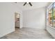 Light filled room with hard wood floors, ceiling fan, and bathroom attached at 9118 Lake Chase Island Way # 9118, Tampa, FL 33626