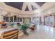 Spacious clubhouse interior showcases elegant seating, a cozy library, and French doors leading to outdoor views at 9118 Lake Chase Island Way # 9118, Tampa, FL 33626