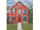Inviting red townhome with a covered entry and colorful shutters at 9118 Lake Chase Island Way # 9118, Tampa, FL 33626
