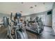 Well-lit gym with treadmills, elliptical machines and free weights at 9118 Lake Chase Island Way # 9118, Tampa, FL 33626