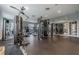 Well-equipped fitness center with modern weight machines, mirrored walls, and ample workout space at 9118 Lake Chase Island Way # 9118, Tampa, FL 33626