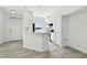 Bright and airy kitchen with white cabinets, modern appliances, and an open layout, perfect for cooking and socializing at 9118 Lake Chase Island Way # 9118, Tampa, FL 33626