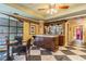 Stylish bar area featuring a marble countertop, decorative shelving, and unique tile flooring at 100 4Th S Ave # 220, St Petersburg, FL 33701