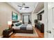 Comfortable bedroom featuring a ceiling fan, modern decor, and ample natural light from the window at 100 4Th S Ave # 220, St Petersburg, FL 33701