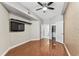 Spacious bedroom with hardwood floors, a ceiling fan, and access to a walk-in closet and ensuite bathroom at 100 4Th S Ave # 220, St Petersburg, FL 33701