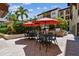 Community courtyard featuring tables and umbrellas for dining, and outdoor grilling stations at 100 4Th S Ave # 220, St Petersburg, FL 33701