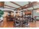 Large dining area with beamed ceilings and ample seating, adjacent to kitchen and living area at 100 4Th S Ave # 220, St Petersburg, FL 33701