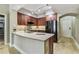 Stylish kitchen with stainless appliances, granite counters, and wood cabinets provides a comfortable culinary space at 100 4Th S Ave # 220, St Petersburg, FL 33701