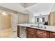 Well-equipped kitchen with stainless steel dishwasher, granite countertops, and access to a spacious living area at 100 4Th S Ave # 220, St Petersburg, FL 33701