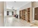 Bright open-concept living room with wood floors, neutral walls, ceiling fan, and natural light at 100 4Th S Ave # 220, St Petersburg, FL 33701