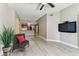 Open-concept living space with wood floors, a ceiling fan, and easy access to the kitchen and entryway at 100 4Th S Ave # 220, St Petersburg, FL 33701
