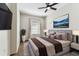Comfortable bedroom featuring a ceiling fan, plush carpeting, and ample natural light at 100 4Th S Ave # 220, St Petersburg, FL 33701
