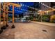 Community patio area with overhead lighting, pavers, landscaping, and comfortable seating at 100 4Th S Ave # 220, St Petersburg, FL 33701