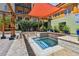 Relaxing spa area with a soaking tub, covered by a shade sail, and landscaped with lush greenery at 100 4Th S Ave # 220, St Petersburg, FL 33701