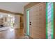 Welcoming entryway with tiled floors, large windows, and an inviting front door with stained-glass sidelight at 103 Morgan Dr, Belleair Beach, FL 33786