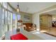 Open living space with a comfy leather sofa, bright windows, office space, and stylish decor accents at 103 Morgan Dr, Belleair Beach, FL 33786