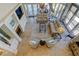 Spacious living room with tile flooring, high ceilings, a fireplace, comfortable seating, and bright natural light at 103 Morgan Dr, Belleair Beach, FL 33786
