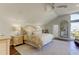 Spacious main bedroom with wood floors, a tall mirror, and an abundance of natural light at 103 Morgan Dr, Belleair Beach, FL 33786