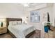 Cozy bedroom with neutral decor, a comfortable bed, and a view of natural light at 1030 Tidewater Shores Loop # 104, Bradenton, FL 34208
