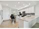Open-concept kitchen with an island, stainless appliances, and ample countertop space at 1030 Tidewater Shores Loop # 104, Bradenton, FL 34208