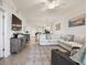 Spacious living room with a modern entertainment center, open layout, and stylish decor at 1030 Tidewater Shores Loop # 104, Bradenton, FL 34208