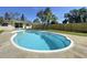 Backyard features a private swimming pool with ladder, a lawn area, and a surrounding wooden fence at 10754 63Rd Ave, Seminole, FL 33772