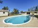 Backyard offers a private swimming pool for relaxation and recreation with lush greenery at 10754 63Rd Ave, Seminole, FL 33772