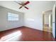 Bedroom with wood floors and natural light at 10754 63Rd Ave, Seminole, FL 33772