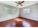 Bedroom featuring hardwood floors and two windows for natural light at 10754 63Rd Ave, Seminole, FL 33772