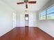 Bedroom features include wood floors, window and built-in closet at 10754 63Rd Ave, Seminole, FL 33772