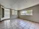 This bonus room features tile flooring and multiple windows, offering plenty of natural light at 10754 63Rd Ave, Seminole, FL 33772