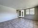 A bonus room with tile flooring and multiple windows providing great light is connected to the main house at 10754 63Rd Ave, Seminole, FL 33772