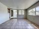 This bonus room has tile flooring, multiple windows, and direct access to the main house at 10754 63Rd Ave, Seminole, FL 33772