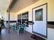 Inviting front porch featuring seating and a charming entryway to the home at 10754 63Rd Ave, Seminole, FL 33772