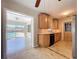 Stylish kitchen with tile floor and view of the backyard pool, great for indoor-outdoor living at 10754 63Rd Ave, Seminole, FL 33772