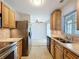 This kitchen includes stainless steel appliances and a dining area at 10754 63Rd Ave, Seminole, FL 33772